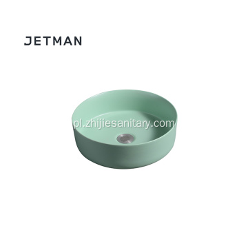 Okrągła ceramiczna umywalka w kolorze zielonym